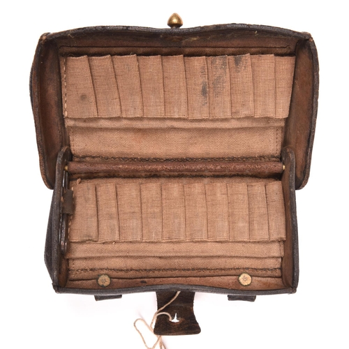 228 - An American M1874 McKeever pattern leather cartridge pouch, the hinged lid impressed “US” in oval pa... 