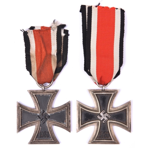 54 - A 1939 Iron Cross 2nd Class with ribbon,  GC; and another similar (one side rusted).  £70-80.