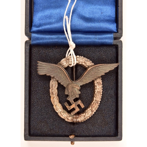 62 - A Third Reich Pilot’s badge,  bronze coloured eagle with silvered wreath, in its fitted case. GC £70... 