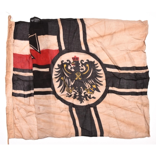 88 - A WWI German military flag,  52” x 33”, red, white and black cloth printed with Iron Cross and Imper... 