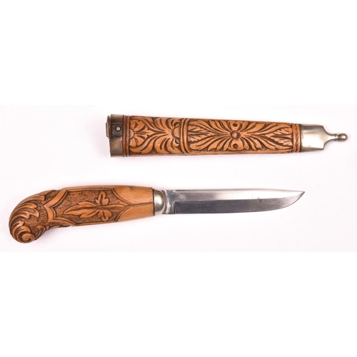 213 - A Scandinavian “filching” knife,  blade 3½”, in its sheath, the hilt and sheath of pale wood carved ... 