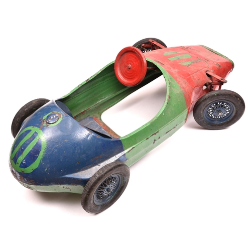 260 - A late 1950's early 1960's Tri-ang Childs Peddle Car. A heavy tinplate toy in the style of a Vanwall... 