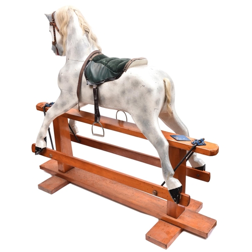 262 - A traditional English children's hand carved wooden rocking horse. This full size horse has been fin... 