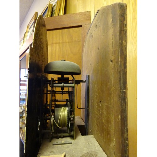 5 - An oak cased longcase clock. Early 19th Century clock striking on a bell with an arched painted face... 