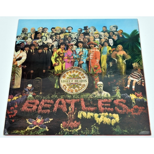 124 - The Beatles - Sgt. Pepper's Lonely Hearts Club Band. Parlophone stereo 12