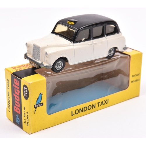 496 - A rare Budgie Colour Trial London Taxi No.703. An example in an unissued white with black roof liver... 