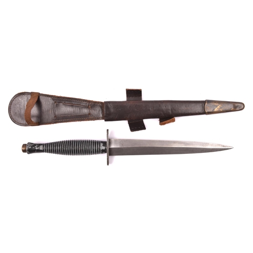 174 - A third pattern FS fighting knife, the grey metal hilt retaining some black painted finish, the cros... 