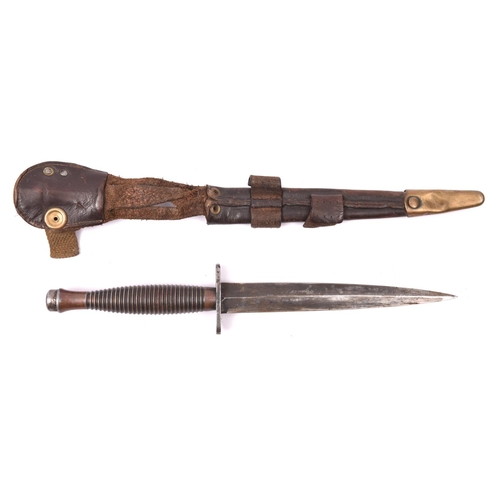 175 - A third pattern FS fighting knife,  with blued blade, the bronzed hilt stamped with small broad arro... 