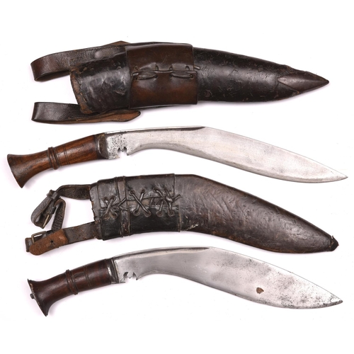 192 - 2 kukris,   with plain wood hilts, in their leather covered sheaths with belt loops GC (both lacking... 