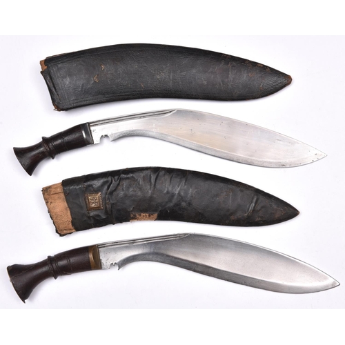 193 - 2 kukris, with plain wood hilts, in their leather covered sheaths. GC (companion knives missing, one... 