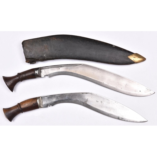 195 - A kukri, blade 13½”, with steel mounted plain wooden hilt, in its leather covered sheath with brass ... 