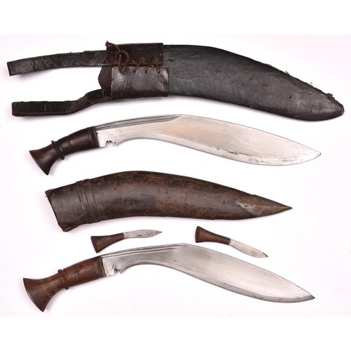 198 - A kukri, with plain wood hilt, in its leather covered sheath with belt loops; and another, with plai... 