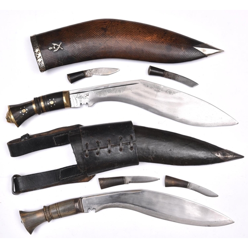 200 - A kukri,  the pale horn hilt with silver coloured mounts, in its leather covered sheath with silver ... 