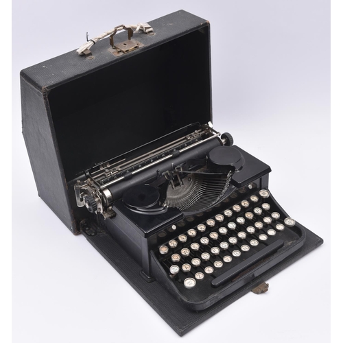 54 - A 1930s Royal portable typewriter. In black finish with a cloth covered wooden case. QGC-GC for age,... 