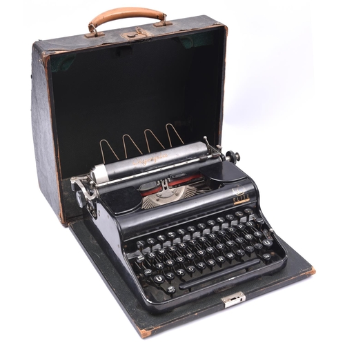 90 - A 1940s Olympia portable typewriter made for the German market, with lid and carrying handle. Basica... 