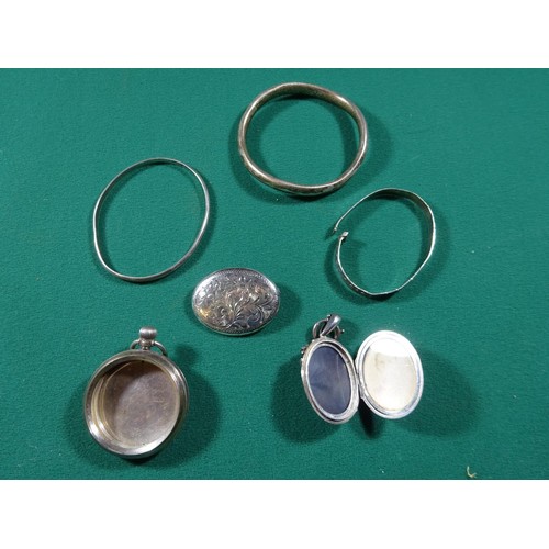 49 - A collection of costume jewellery, silver bangles, silver watch case, etc. 2x Mourning brooches. 8 c... 