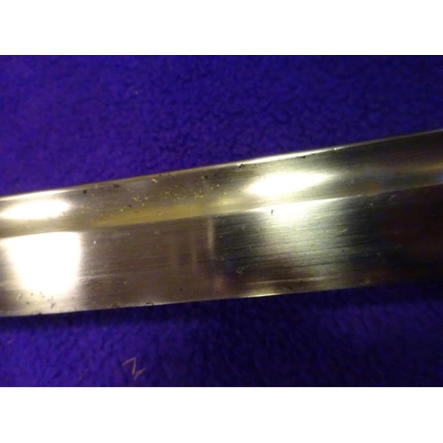 273 - A military katana  with full length grooves, blade appears to have some age with an O-suriage tang a... 