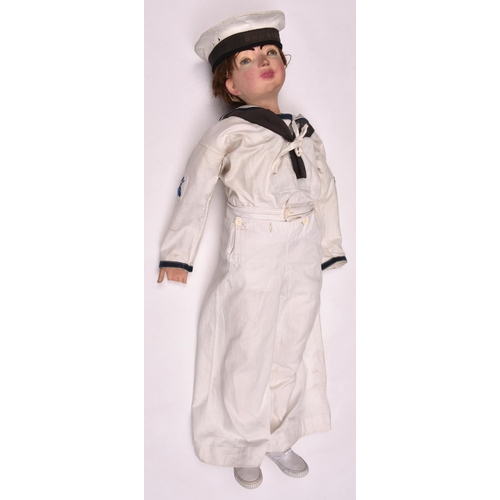 112 - A small boys white sailor suit, comprising hat with HMS Ganges cap tally, sleeved top and undershirt... 