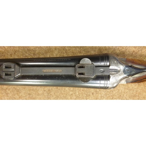 318 - **A good double barrelled side by side 12 bore/8x57mm top lever hammerless boxlock non ejector sport... 