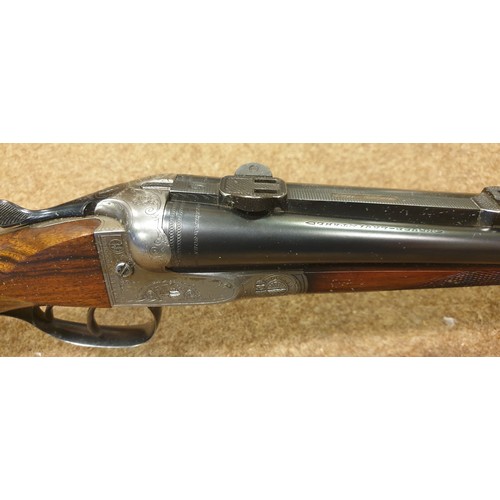 318 - **A good double barrelled side by side 12 bore/8x57mm top lever hammerless boxlock non ejector sport... 