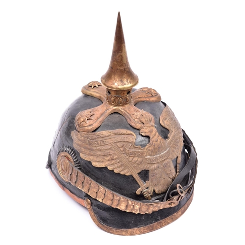 103 - A copy of an 1860 Prussian officer's pickelhaube, with brass mounts, officer's pattern cockades, chi... 