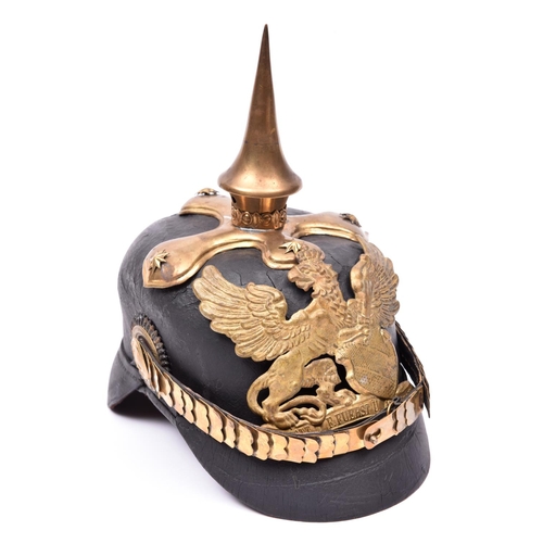 107 - A copy of a Baden officer's pickelhaube, with brass mounts, officers pattern cockades, and chin scal... 