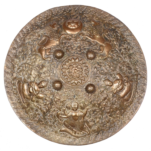 24 - A decorative Indian brass shield dhal, 19