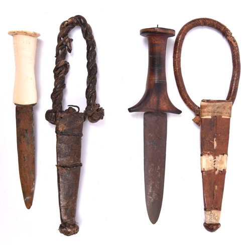 264 - A Sudanese arm dagger, plain flat blade 5¼