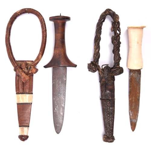 264 - A Sudanese arm dagger, plain flat blade 5¼