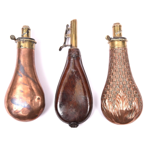 276 - An embossed copper gun size powder flask 