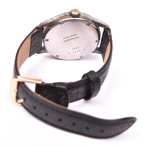 32 - DH marked Helvetia wristwatch. Serial D6594H. Plated case with brushed finish, heavy wear to plating... 