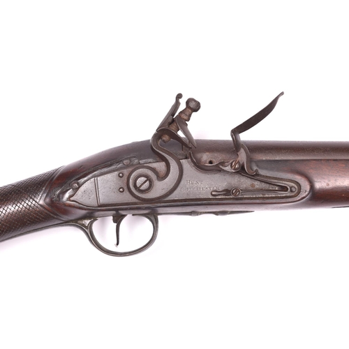 343 - A late 18th century 10 bore flintlock fowling piece, by Hunt of Colchester, barrel 42