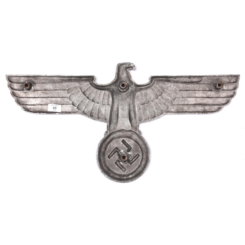 65 - A large Third Reich silvered cast iron wall eagle, span 26½