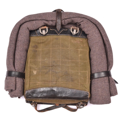 66 - A good example of a WWII German Army tournister (pack), leather stamped 