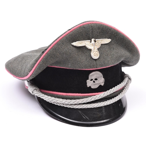 75 - A Third Reich SS Panzer officer's peaked cap, with metal skull and eagle, silver bullion cords, and ... 