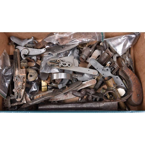 284 - A quantity of old and a few antique gun parts, including a pair of back action pin-fire locks by F. ... 