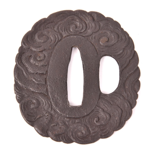 284 - An iron tsuba depicting a dragon in clouds, gold detail, GC £100-150