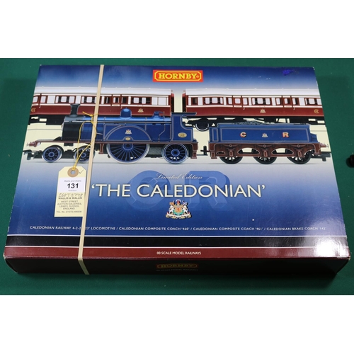 131 - A Hornby OO gauge The Caledonian train pack (R2610). Comprising a Caledonian Railway 4-2-2 tender lo... 