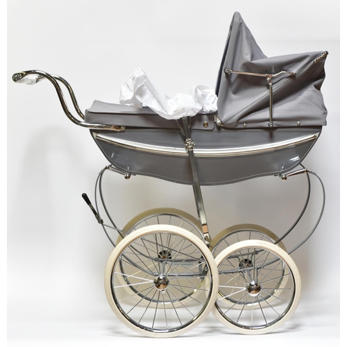 223 - A Silver Cross Doll's Pram. A very substantially built modern issue of this classic pram with gloss ... 