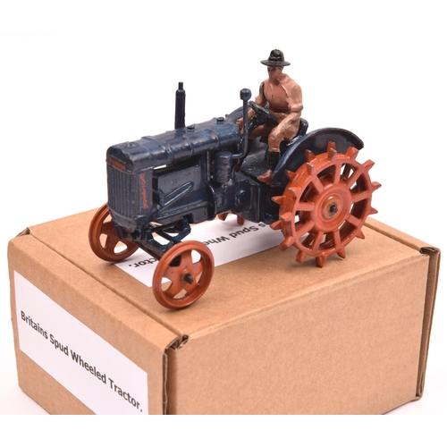 392 - A Britains Spudded Wheeled Fordson Major Tractor (127F). In dark blue with orange metal wheels. Comp... 