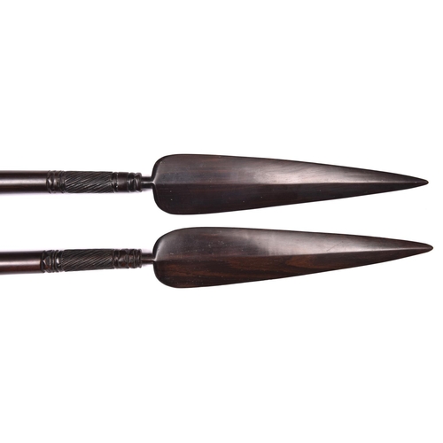 32 - A pair of decorative African short ebony spears, 26