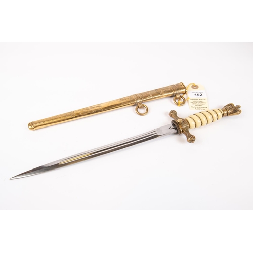 102 - A Third Reich Naval officer's dagger, with plain unmarked blade, in its sheath. GC £350-400