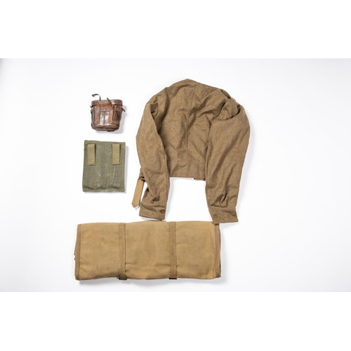 128 - A WWII cover for an Oerlikon gun, a 1949 pattern BD blouse; a pair of WW1 German field glasses (AF);... 