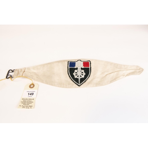 149 - A WWII Free French arm band, white cloth with wheeled sword badge. GC £40-60