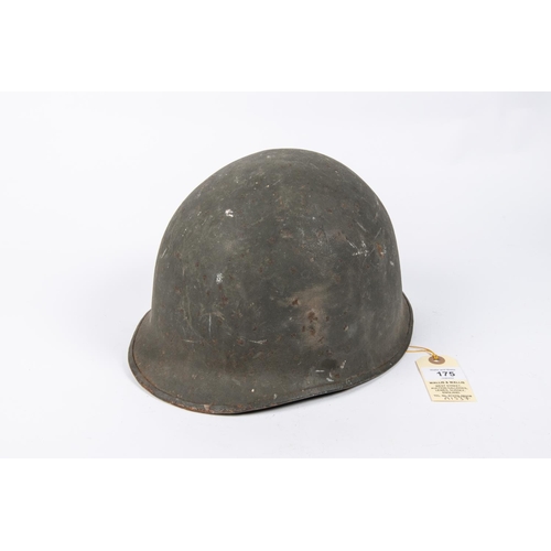 175 - A WWII US Steel helmet, complete with lining and original combat finish. GC £40-50