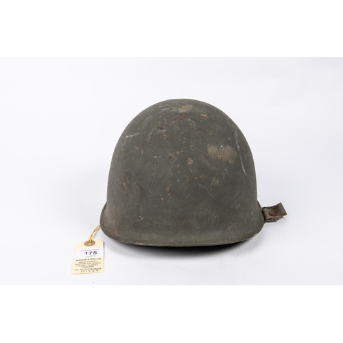 175 - A WWII US Steel helmet, complete with lining and original combat finish. GC £40-50