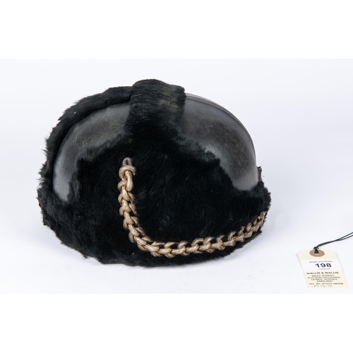 198 - A pre WWII RAF full dress parade helmet, leather covered with fur trim, silk lining, and patent leat... 