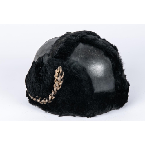 198 - A pre WWII RAF full dress parade helmet, leather covered with fur trim, silk lining, and patent leat... 