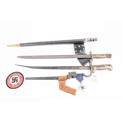 255 - A French 1874 Gras bayonet (the blade shortened and bent); a 1907 SMLE bayonet (deeply pitted overal... 