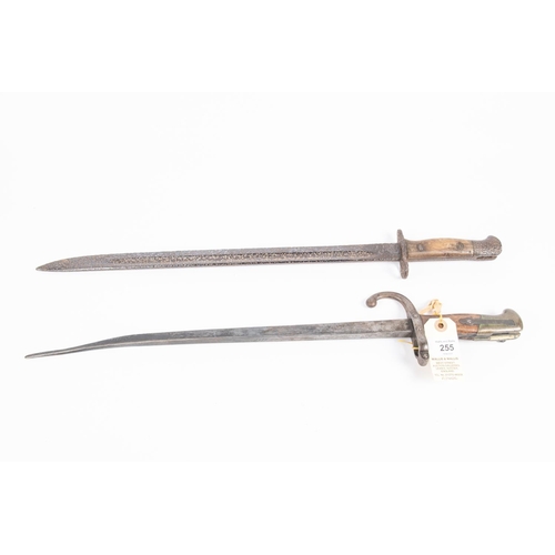 255 - A French 1874 Gras bayonet (the blade shortened and bent); a 1907 SMLE bayonet (deeply pitted overal... 